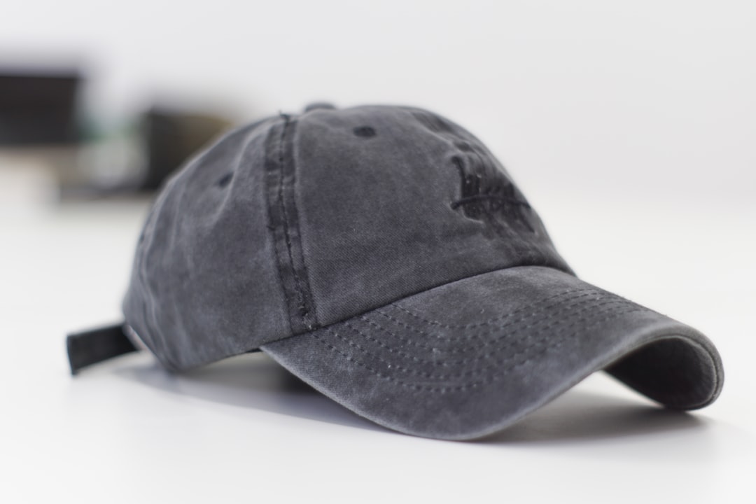 about-img gray-baseball-cap-on-white-surface-2lokxdi6hmo